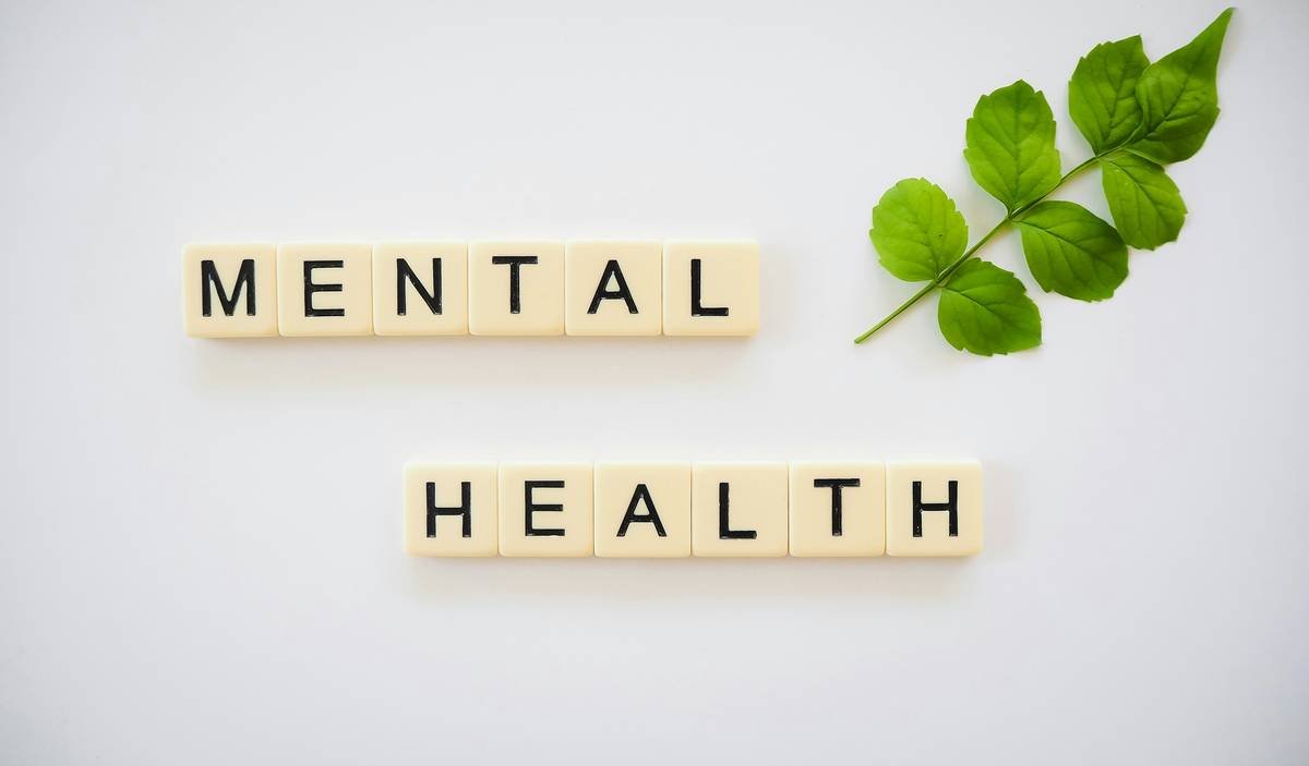 Infographic showing gap between political risk insurance (covers assets) and mental health coverage (covers clinical treatment), with overlap labeled 'crisis-induced trauma – rarely covered'