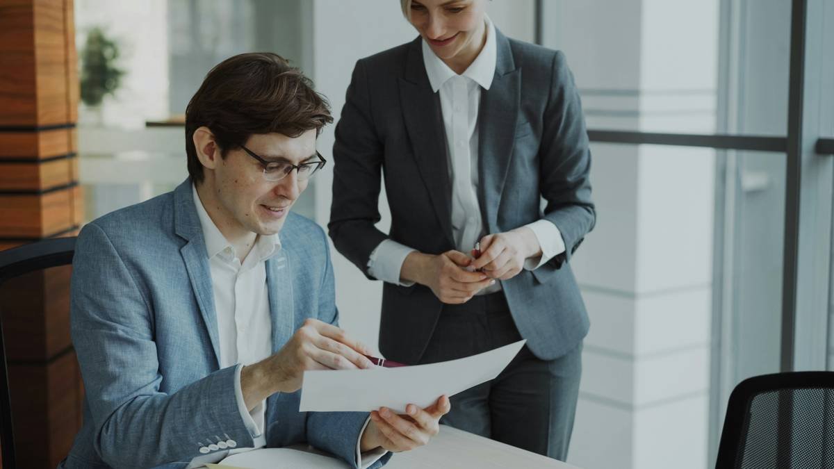 Business executive reviewing documents related to an unlinked transaction for political risk insurance claim