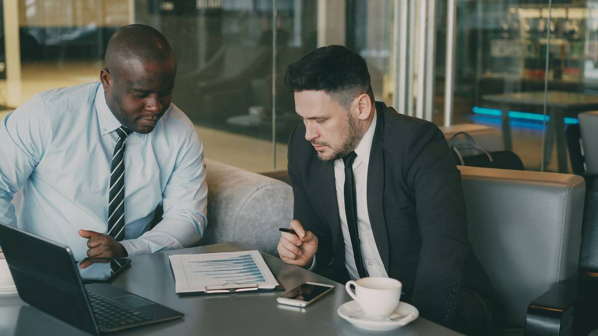 Business executive reviewing crisis support documents during political unrest